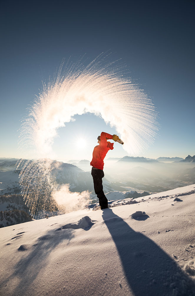 woman throwing snow
